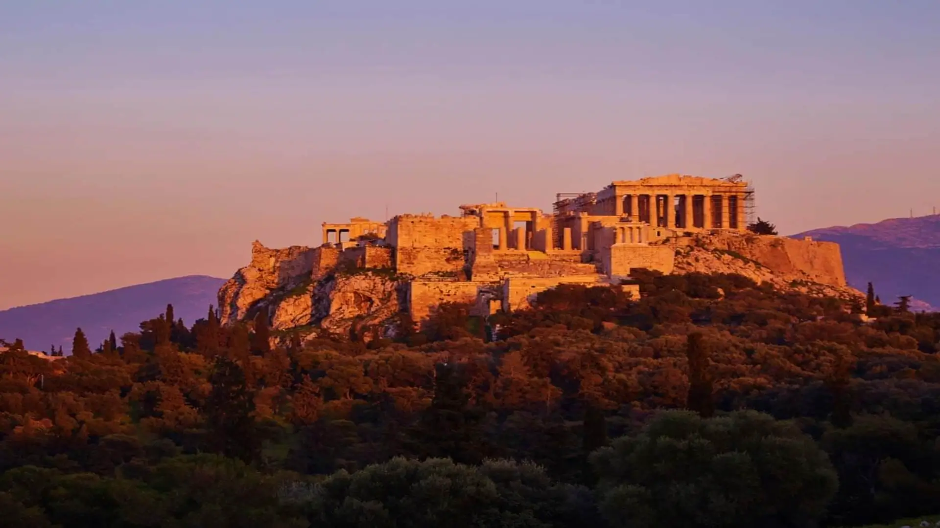 Far shot of the Acropolis Hill in teh sunset